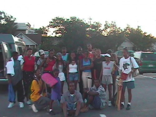 Group of young athletes and coaches at Panthers Elite Track & Field Club outdoor event.