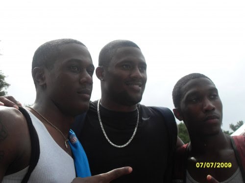 Three young athletes from Panthers Elite Track & Field Club outdoors on a cloudy day.
