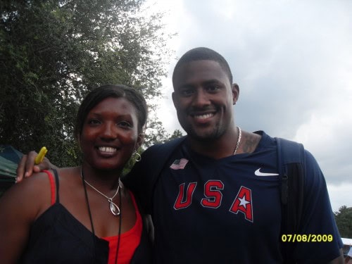 A vibrant photo of two smiling athletes outdoors, celebrating their achievements.