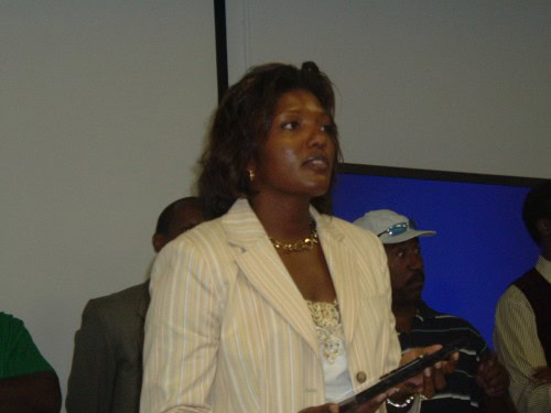 An athletic coach speaking at a Panthers Elite Track & Field event.