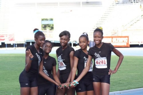 Panthers Elite Track & Field team celebrating on the track field.
