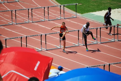 Young athletes competing in hurdles at Panthers Elite Track & Field meet.