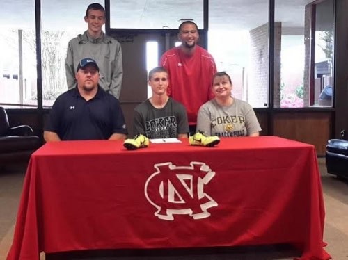 Anthony Clontz signing with Panthers Elite Track & Field Club at a signing event.