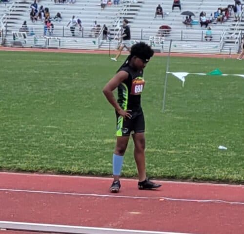 Panthers Elite track athlete preparing for a race on the track.