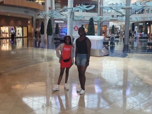 Young athletes at shopping mall for team event.
