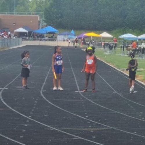 Young athletes preparing for a race at Panthers Elite Track & Field Club event.