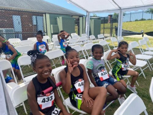 Young athletes preparing for a race outdoors.