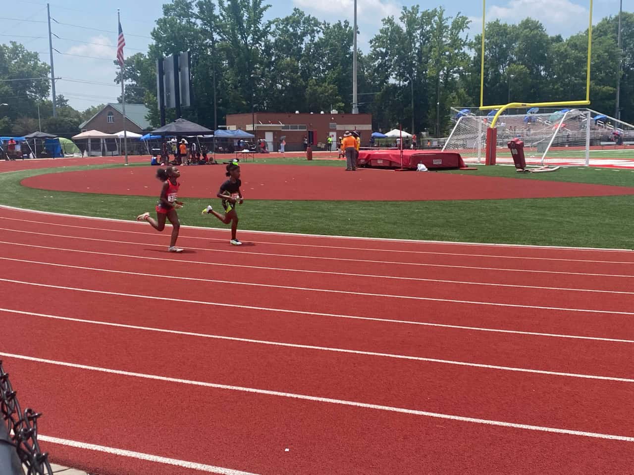 Panthers Elite athletes running on the track during a meet.