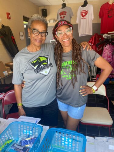 Panthers Elite Track & Field Club team members smiling at an event.