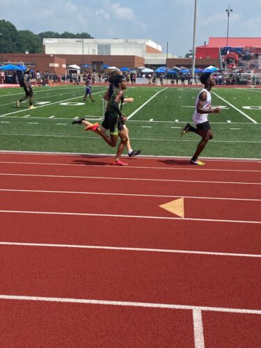 Young athletes competing in a sprint race at Panthers Elite Track & Field event.