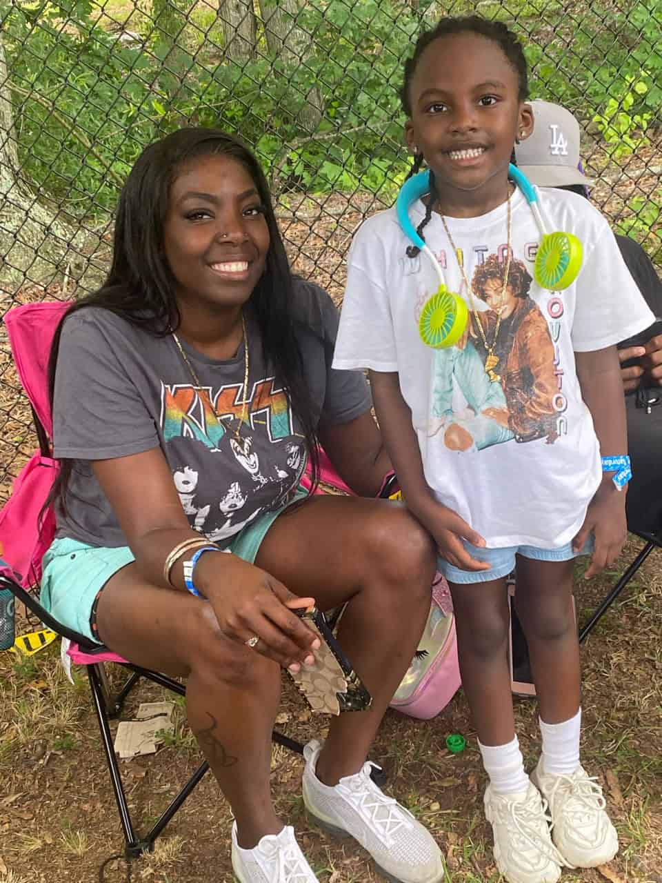 Young girl and coach smiling at Panthers Elite Track & Field Club event.