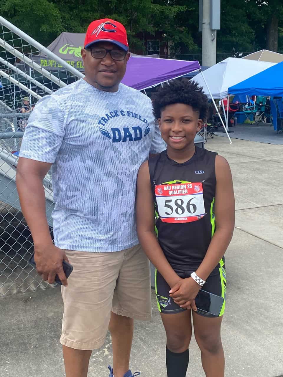 Father and daughter at track meet.