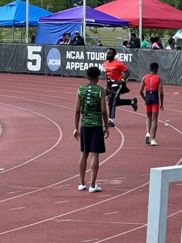 Panthers Elite athletes competing at a track and field event.
