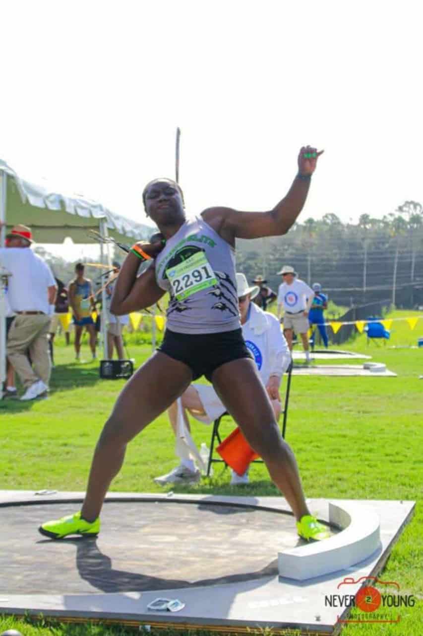 Panthers Elite track athlete preparing for shot put event.