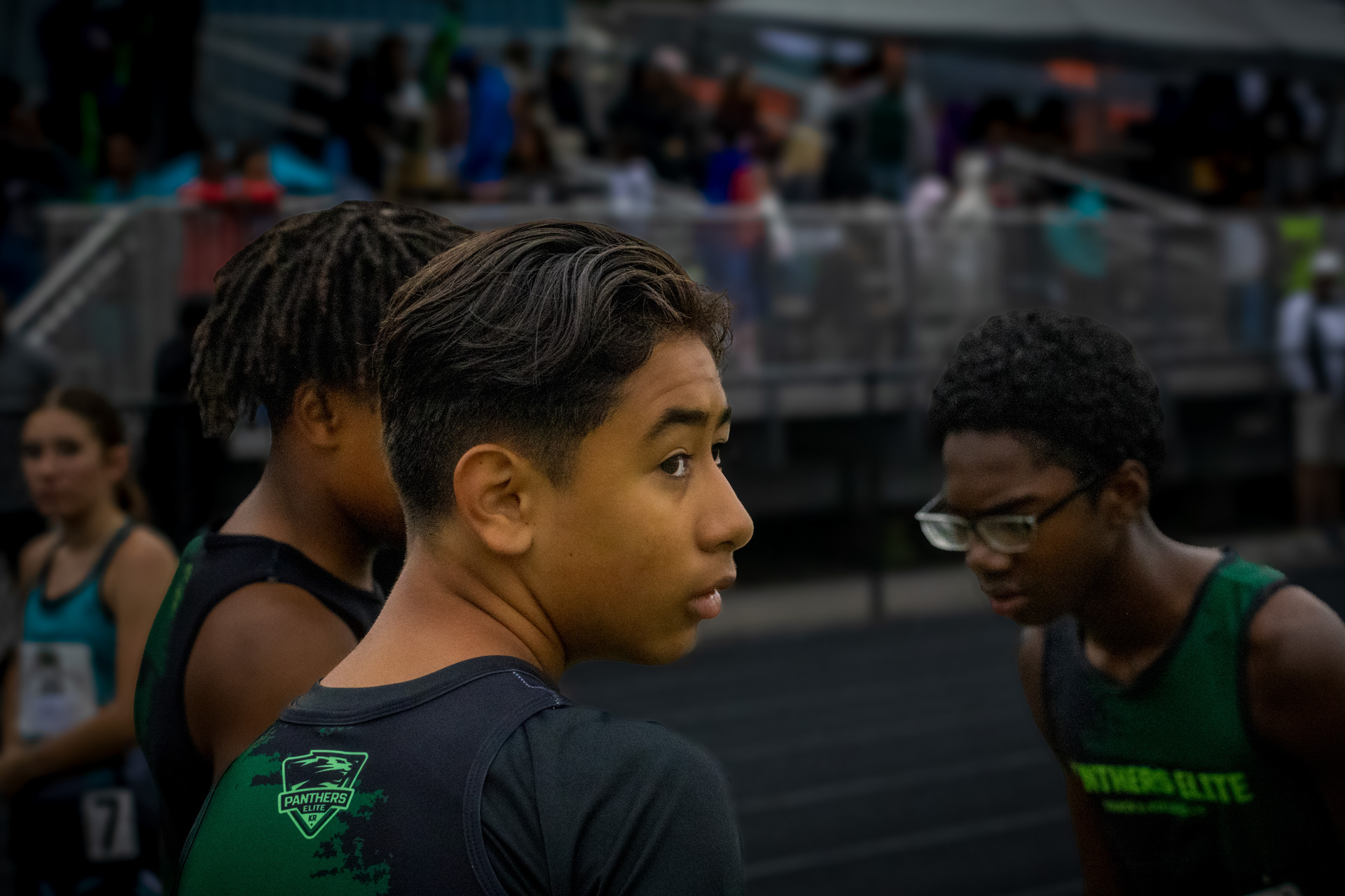 Panthers Elite track athletes preparing for a race at a track meet.