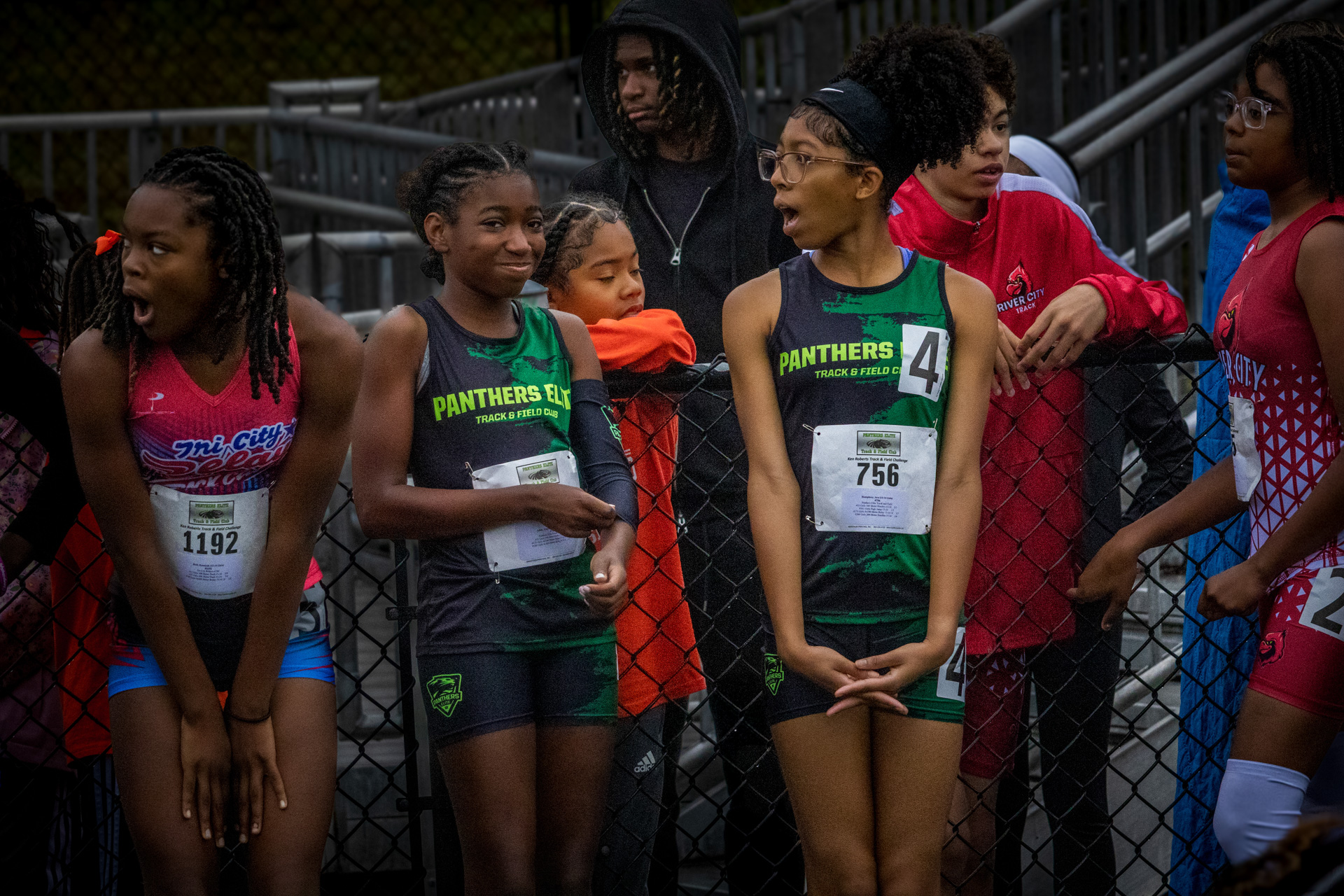 Young athletes preparing for a track event at Panthers Elite Track & Field Club.