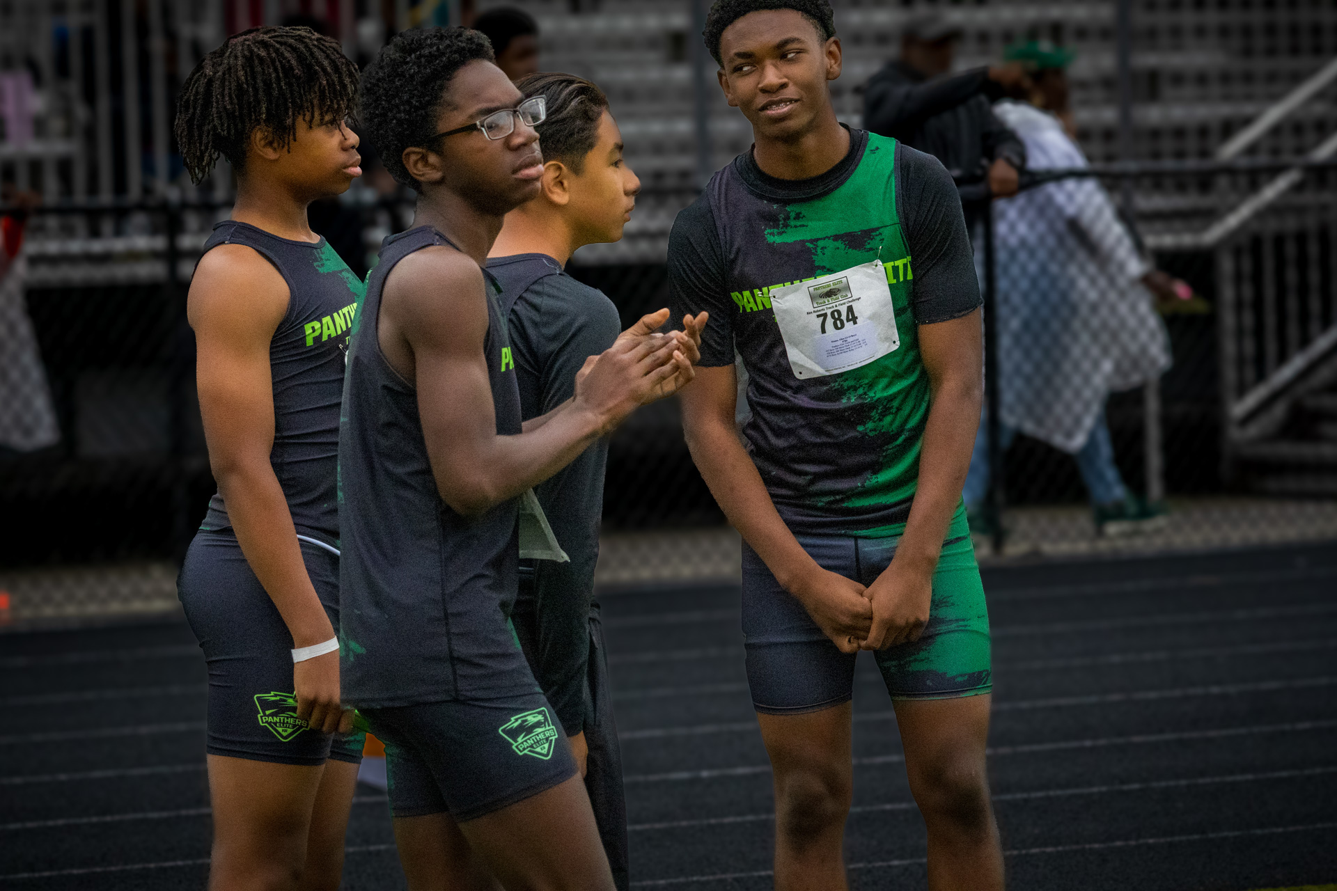 Group of young athletes from Panthers Elite Track & Field Club preparing for a race.