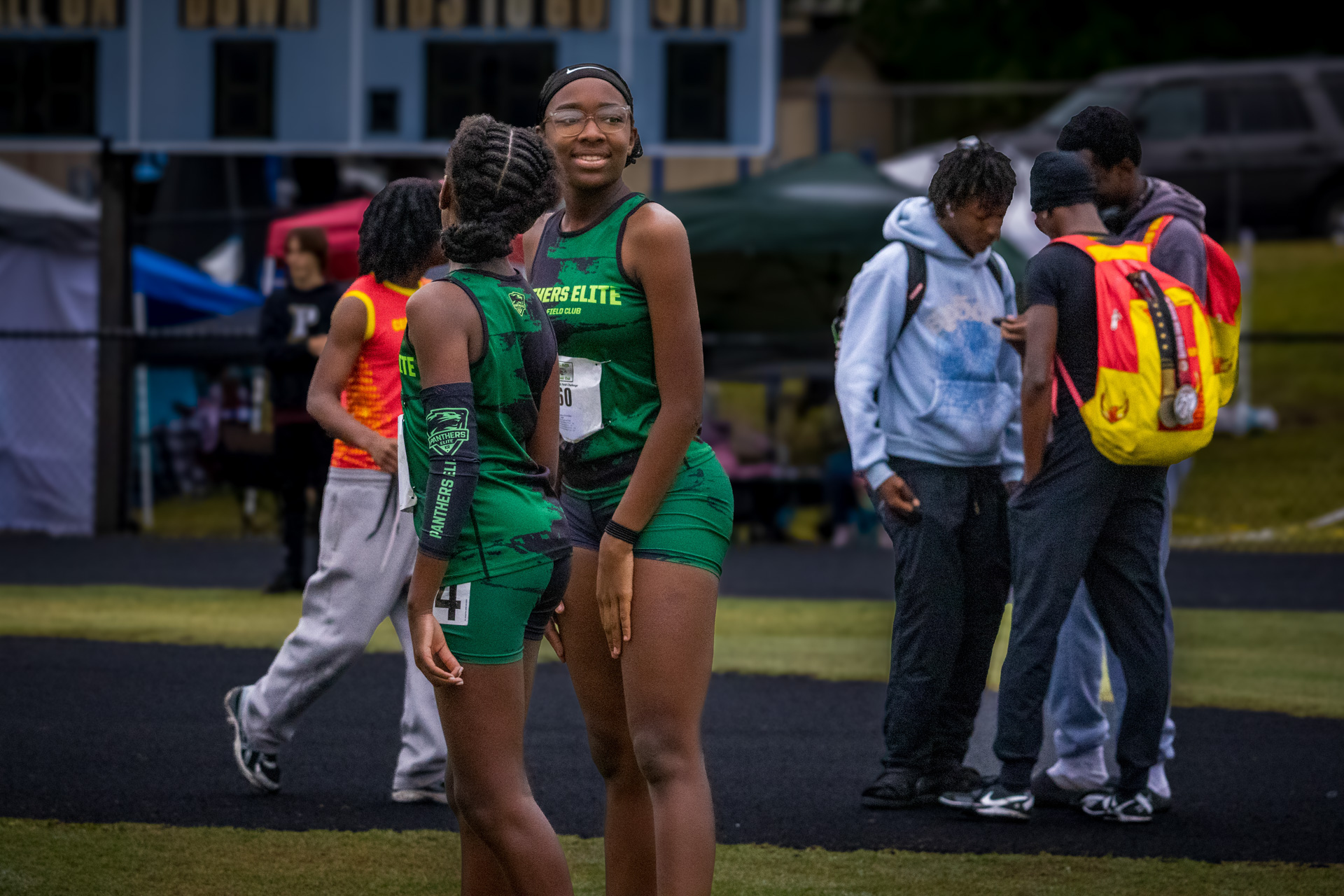 Panthers Elite track athletes preparing for a meet at the stadium.