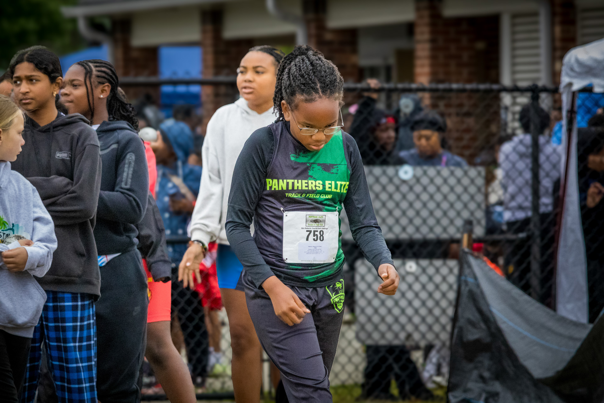 Young female athlete participating in a track and field event at Panthers Elite.