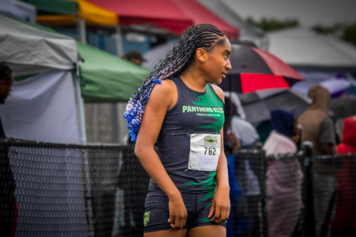 Female track athlete from Panthers Elite Track & Field Club at outdoor meet.