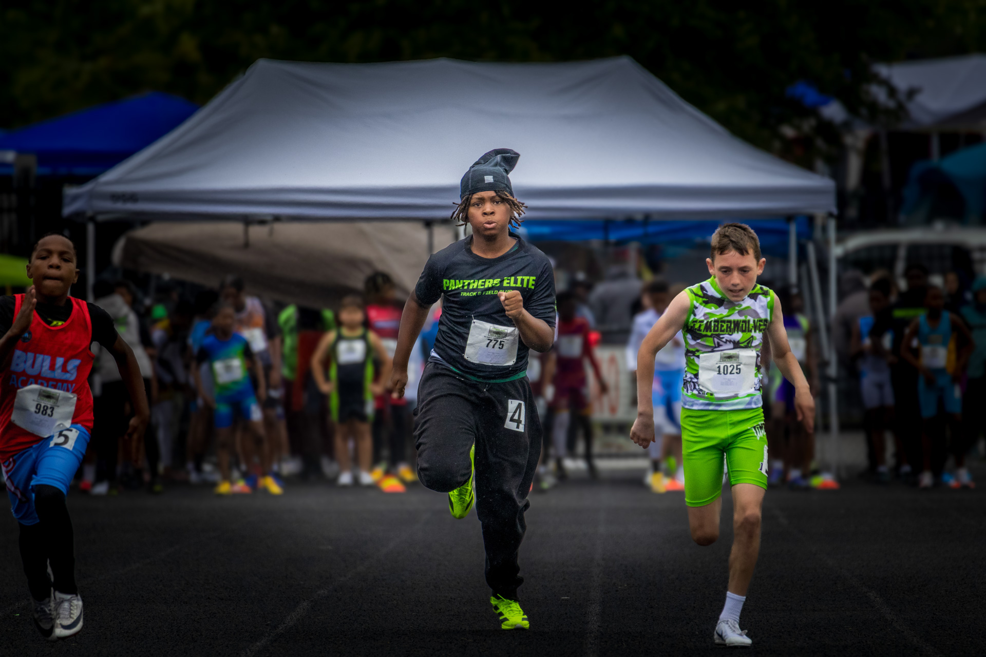 Young athletes competing in a track race at Panthers Elite Track & Field Club event.