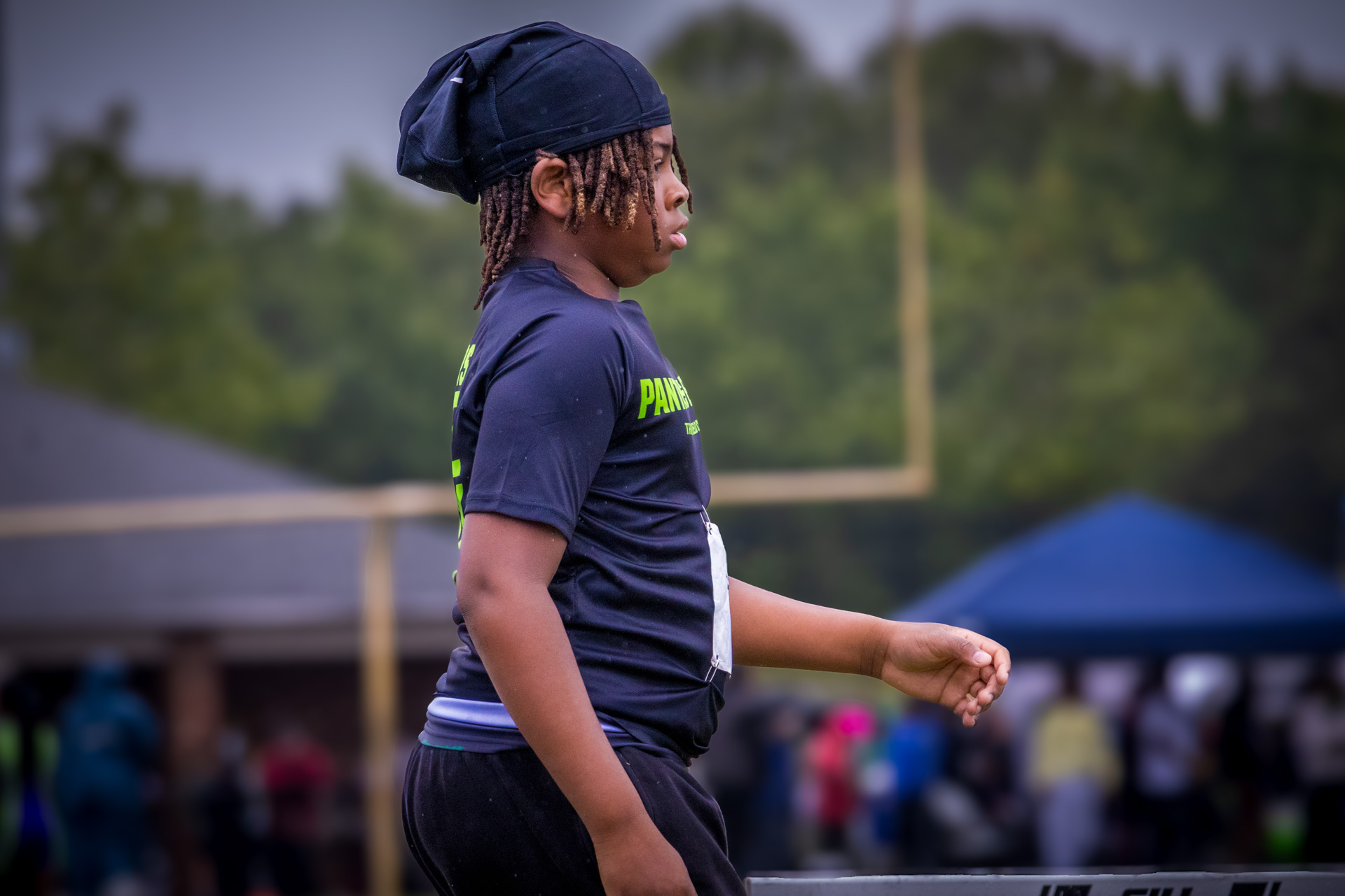 Athlete from Panthers Elite Track & Field Club preparing for a race on the track.