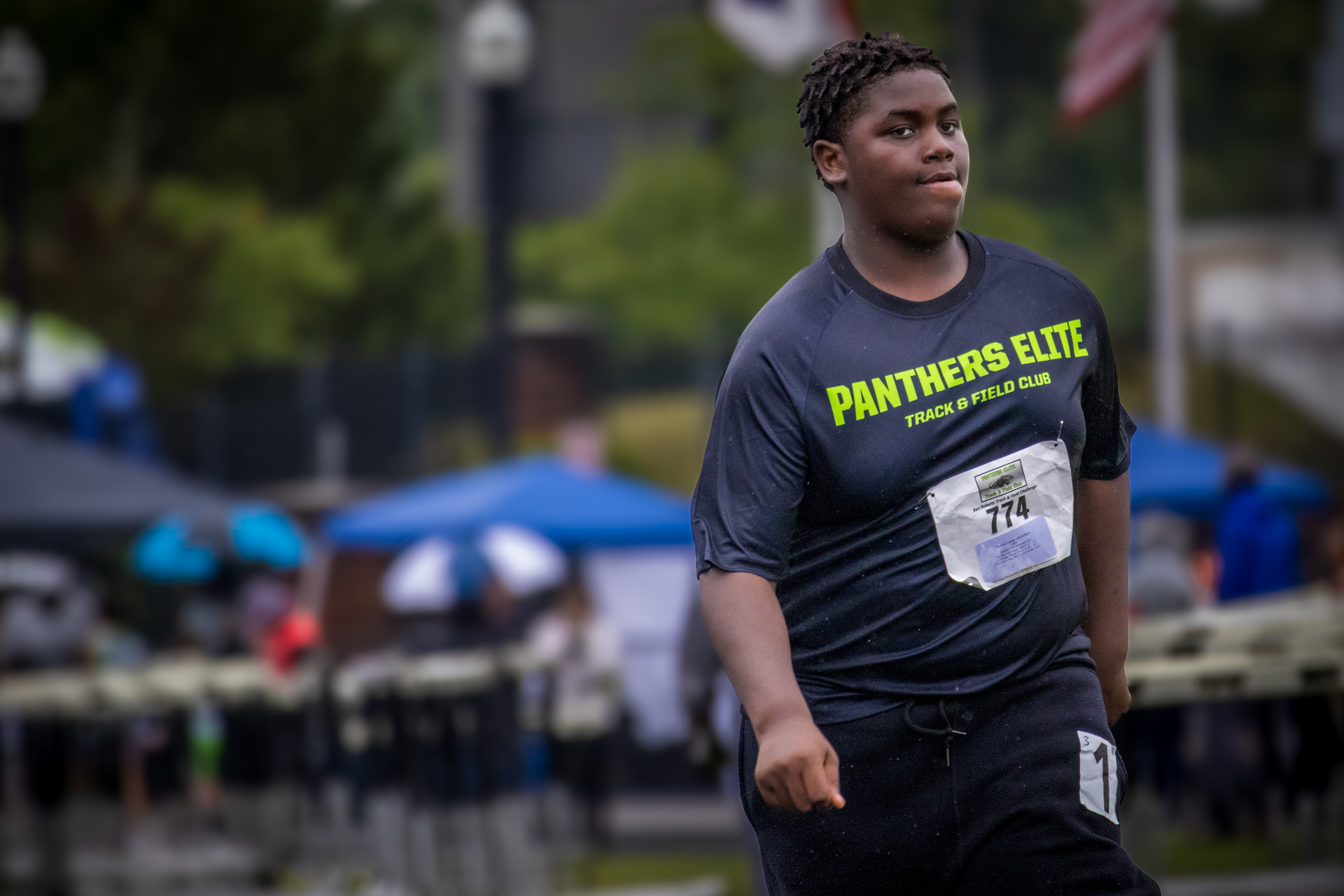 Young male athlete at Panthers Elite Track & Field Club during a race.