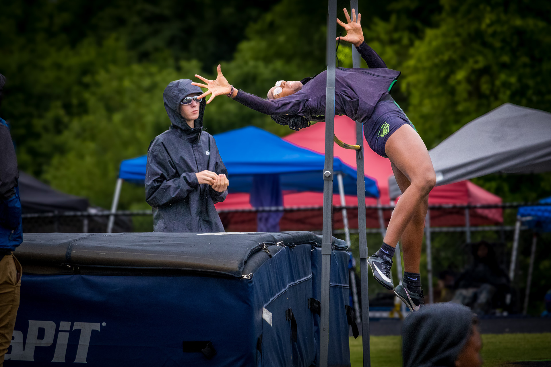 Female athlete practicing high jump at Panthers Elite Track & Field meet.