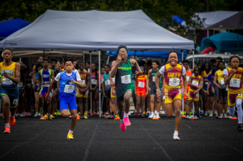 Young athletes competing in a track race at Panthers Elite Track & Field Club event.