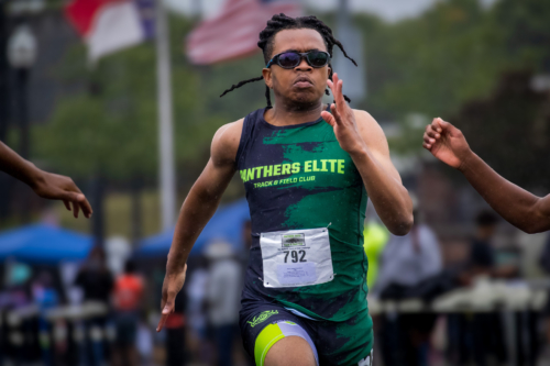 Female track athlete from Panthers Elite Track & Field Club running on the track.