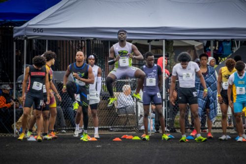 Track and field athletes preparing for a race at Panthers Elite.