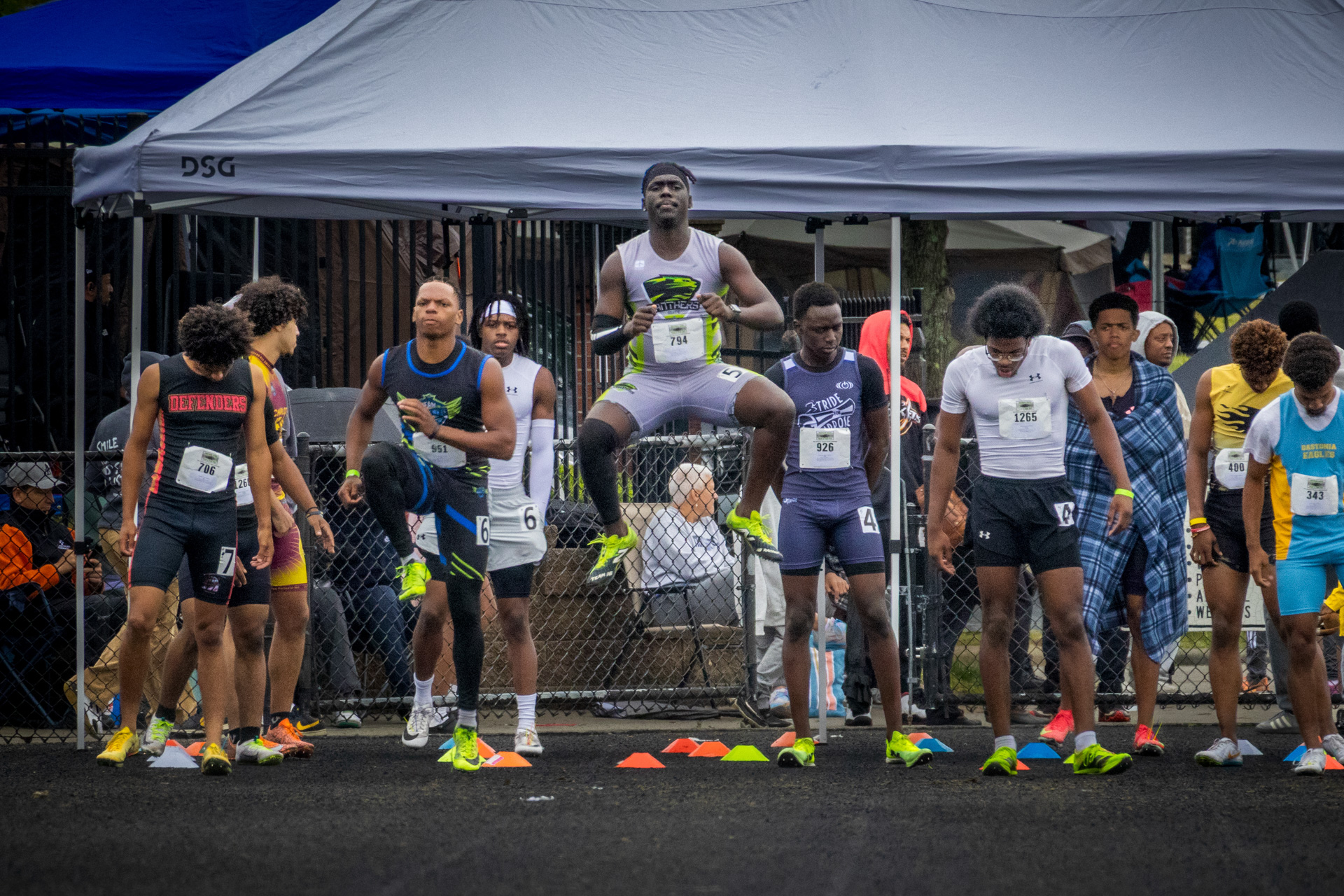 Track and field athletes preparing for a race at Panthers Elite.
