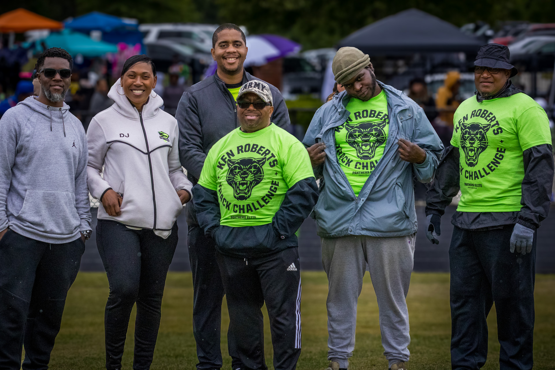 Panthers Elite Track & Field team members smiling at outdoor event.