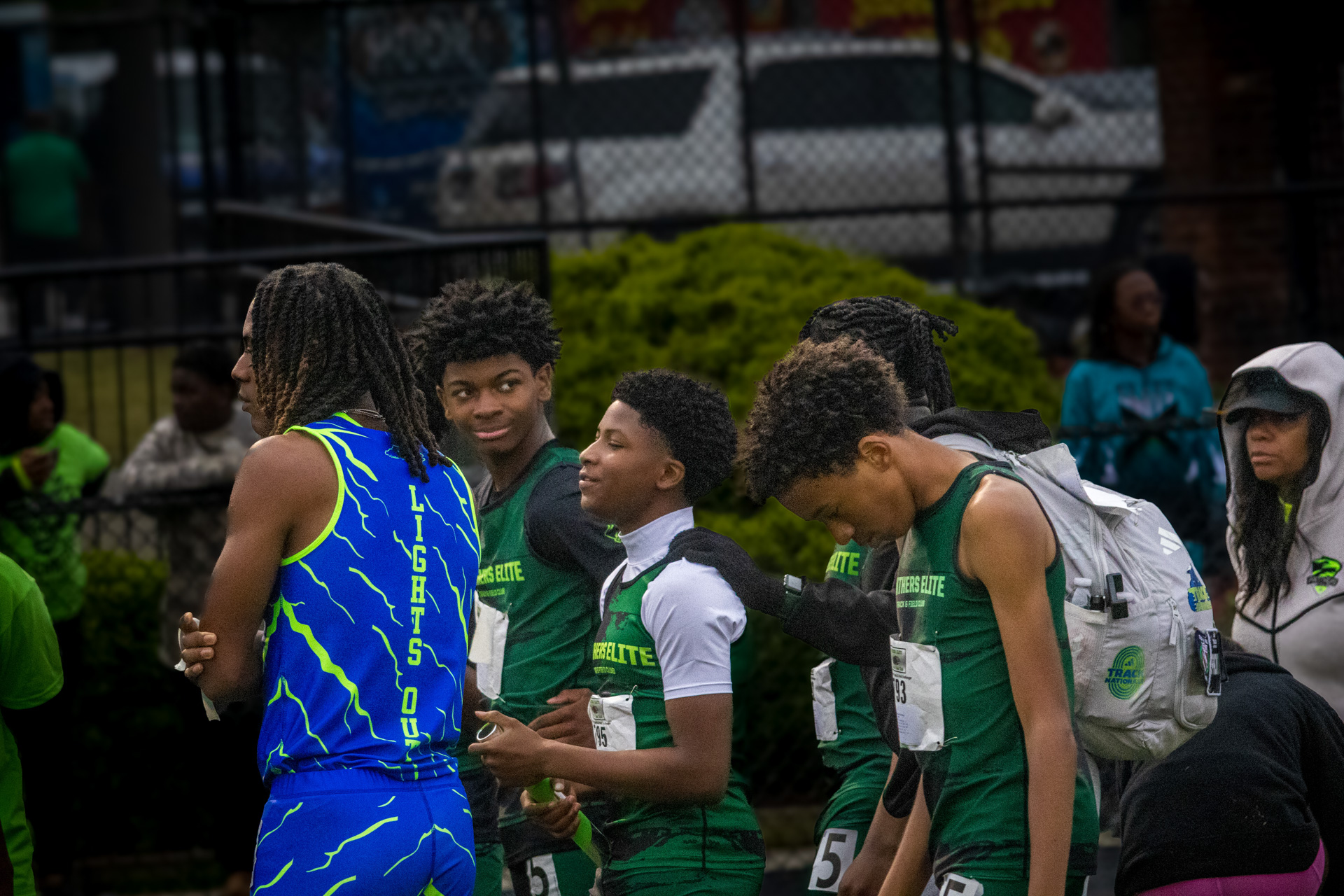 Panthers Elite track athletes talking before a race at the track.