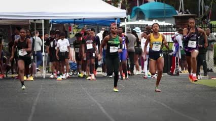 Young athletes competing in a track race at Panthers Elite Track & Field Club event.