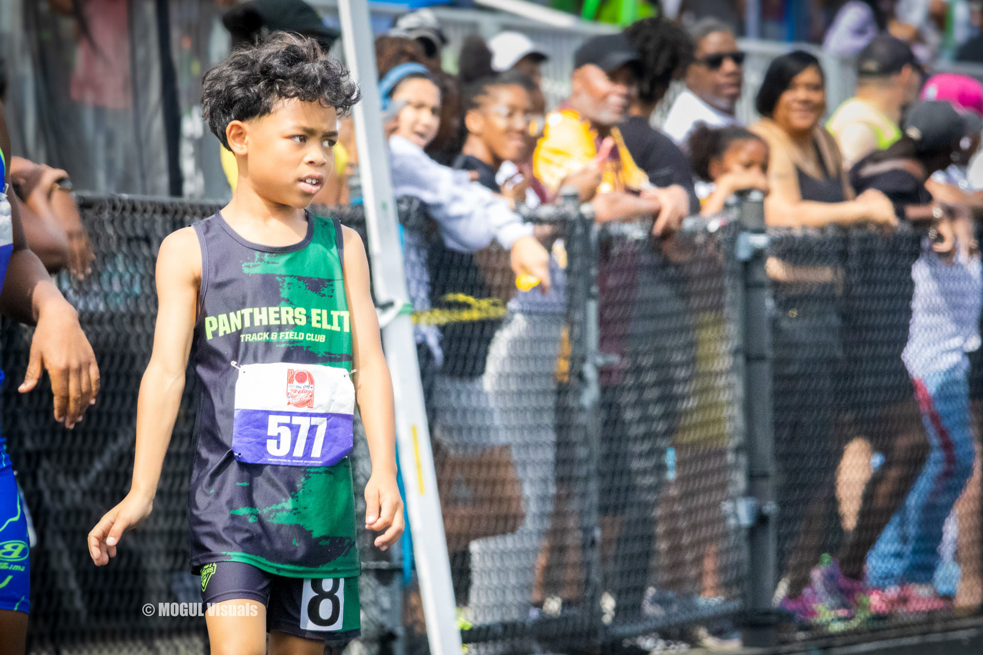 Young Panthers Elite athlete preparing for a race at a track event.