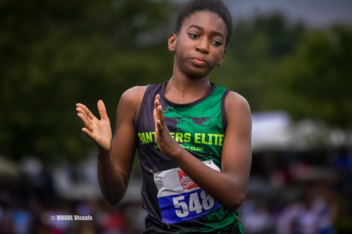Young female athlete from Panthers Elite Track & Field Club preparing for a race.