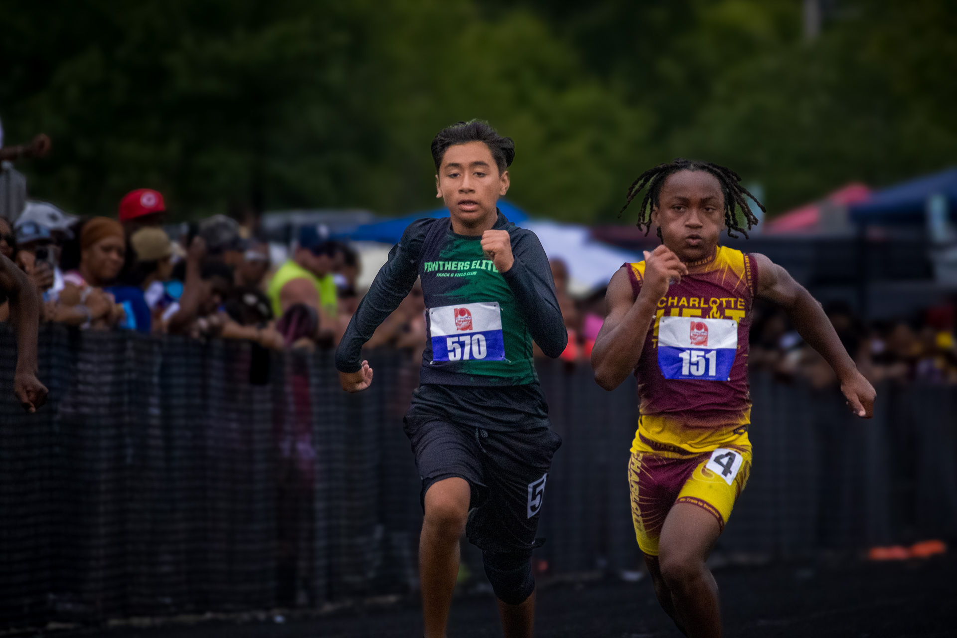 Young athletes competing in a track race at Panthers Elite Track & Field Club event.