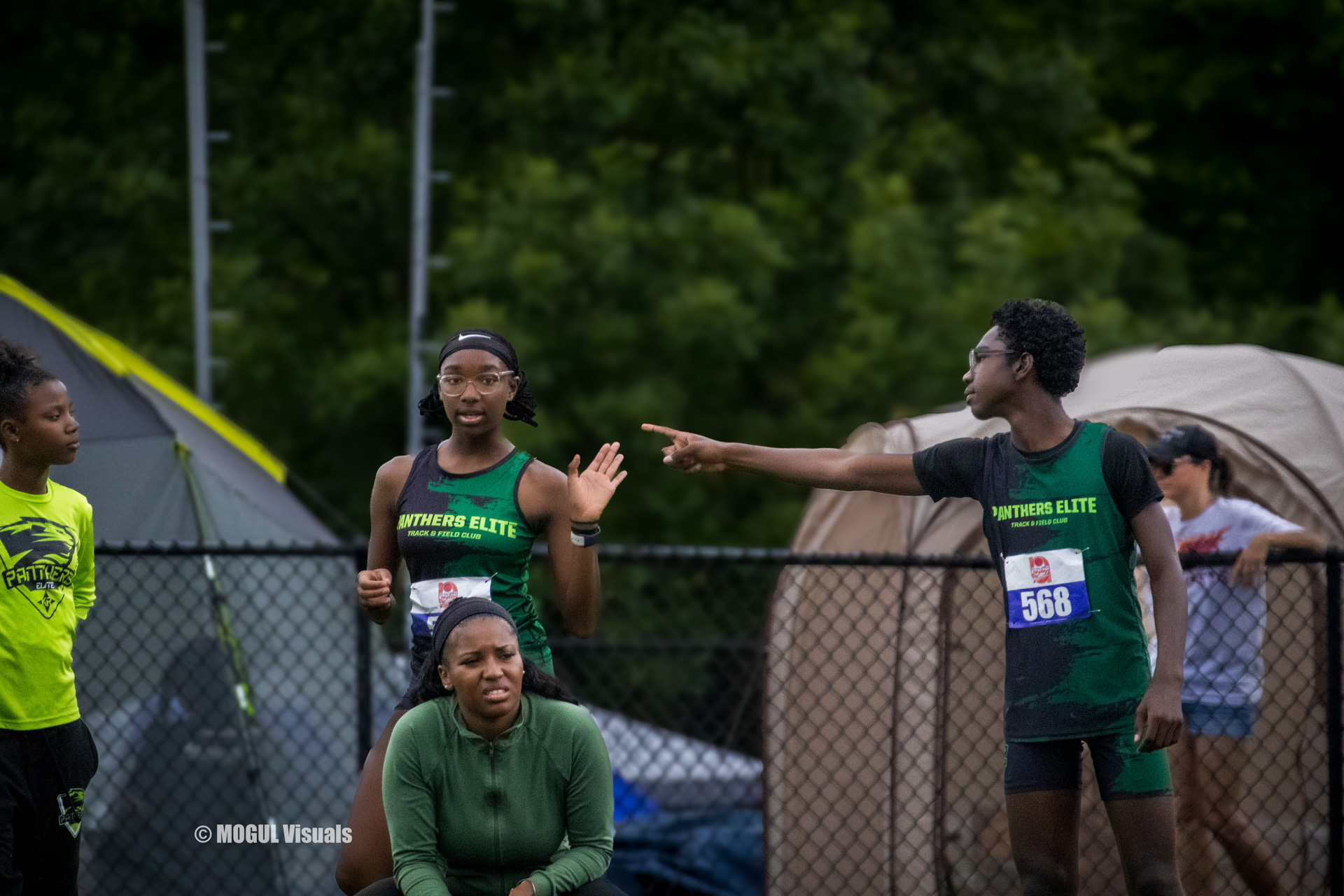 Panthers Elite athletes preparing for a relay race at the track meet.