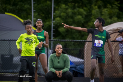 Panthers Elite track athletes preparing during a practice session outdoors.