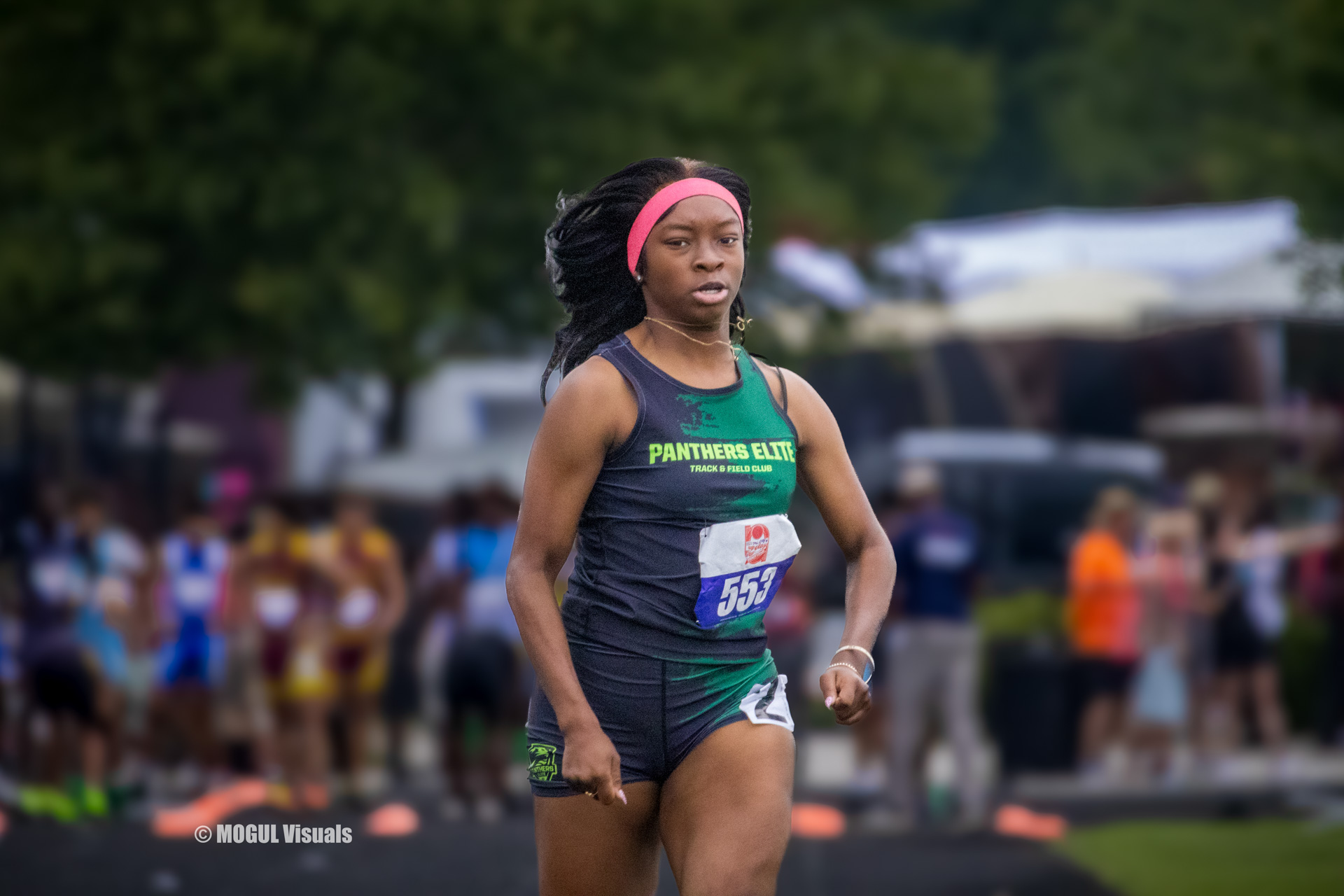 Female track athlete from Panthers Elite Track & Field Club during a race.