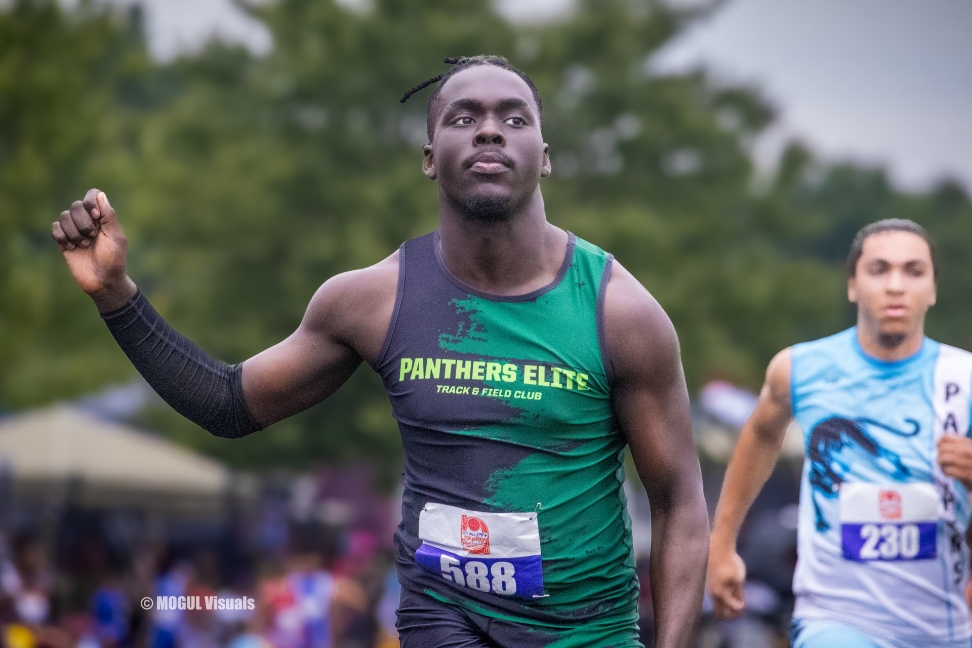 Panthers Elite track athlete running during a race outdoors.