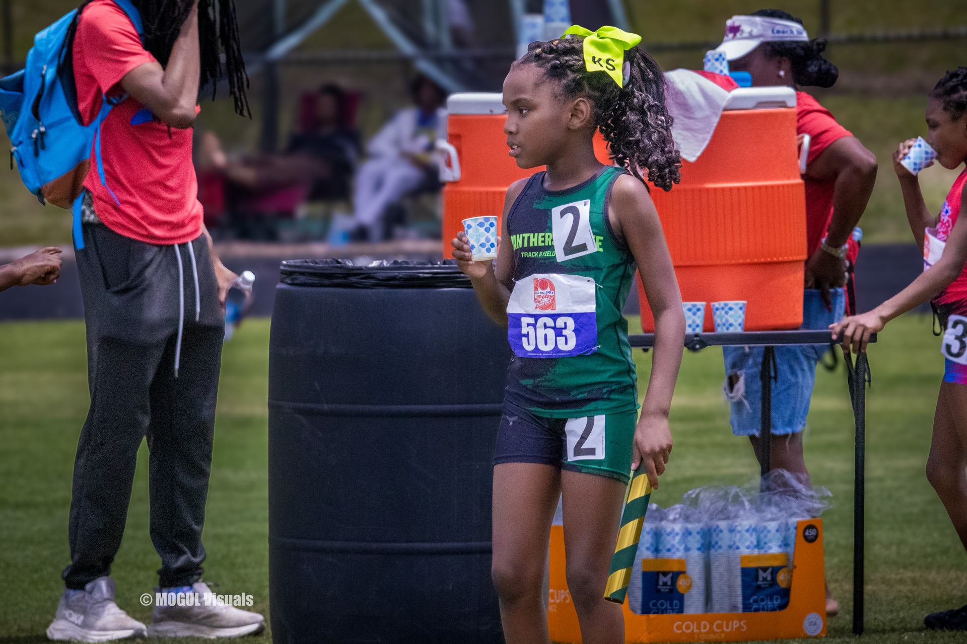 Young female athlete preparing for a race at a track meet.