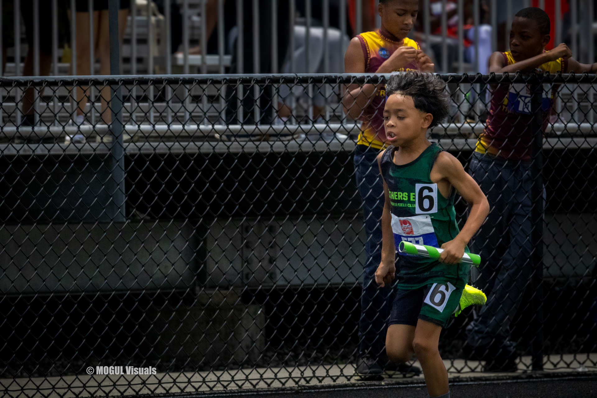 Young athlete running in a track event at Panthers Elite Track & Field Club.