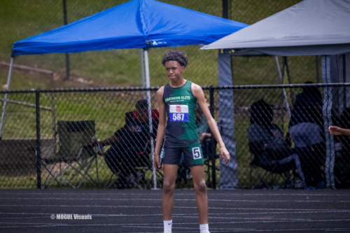 Young athlete at Panthers Elite Track & Field meet standing on the track.