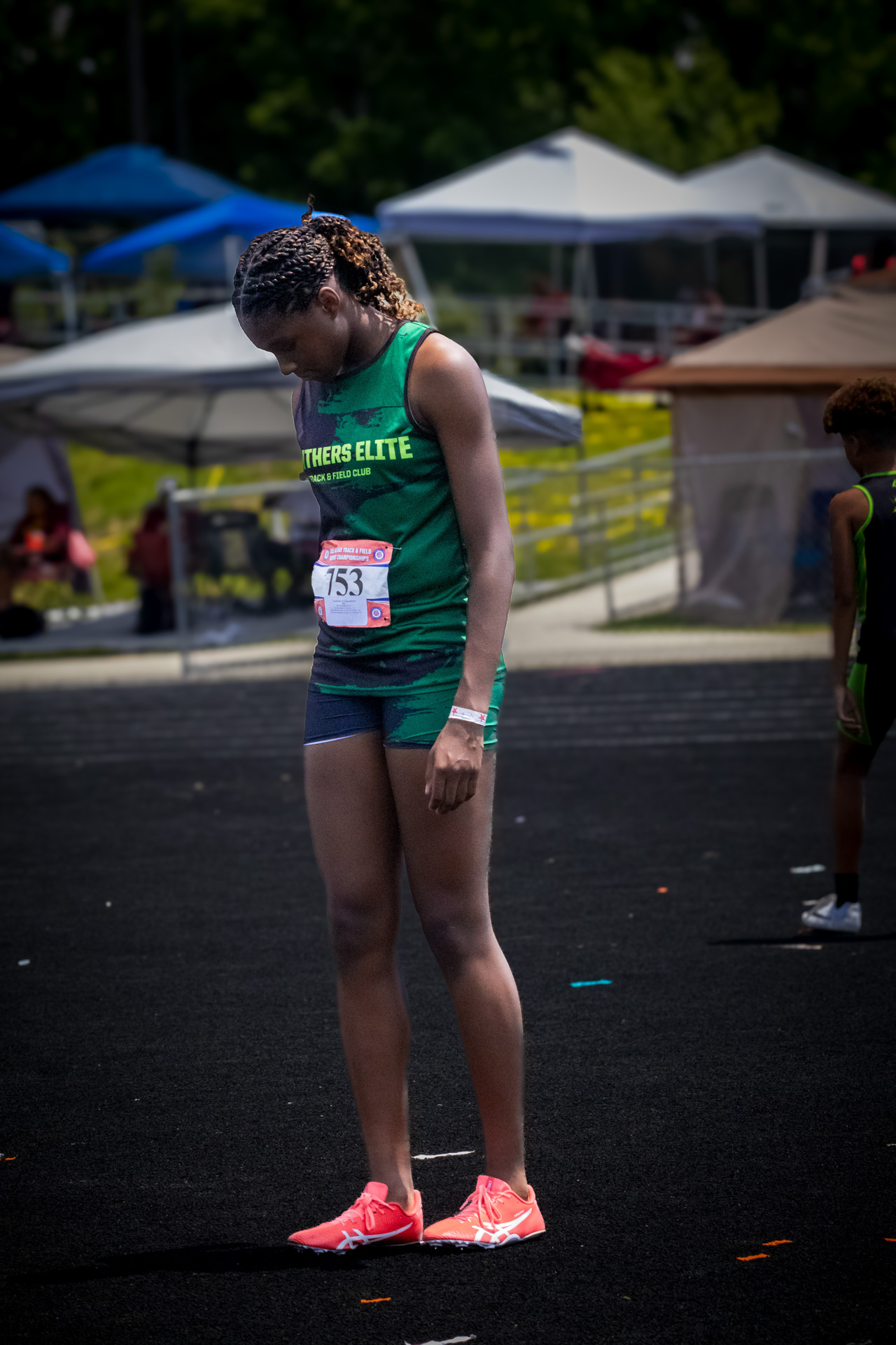 Panthers Elite Track & Field athlete preparing for race at district qualifier.