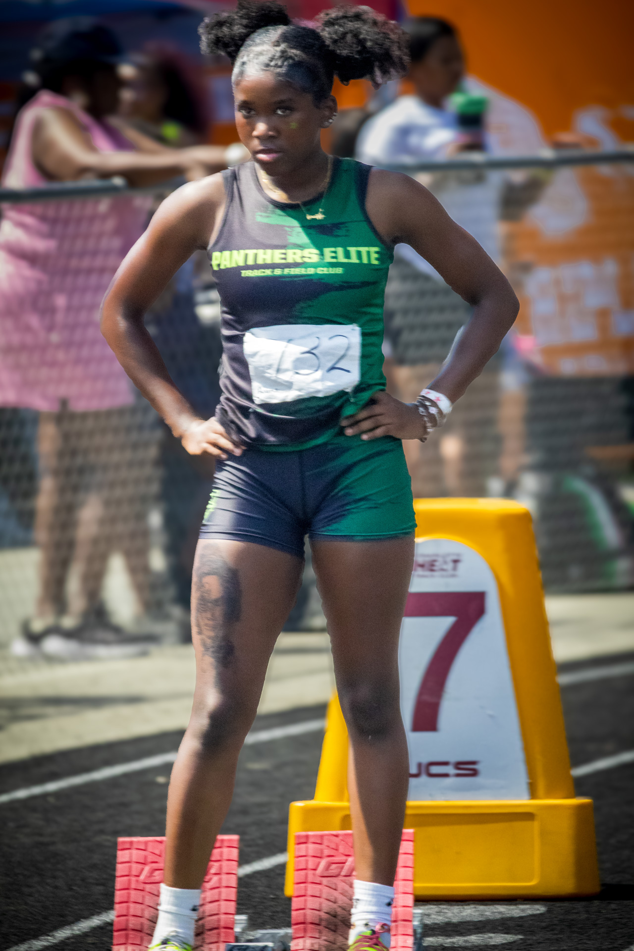 Young female athlete in Panthers Elite uniform at district qualifier.