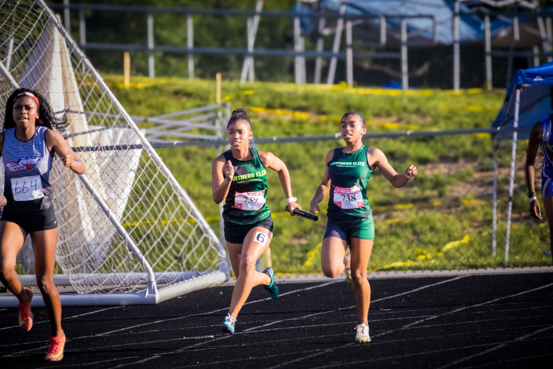 Panthers Elite runners competing at district track meet in 2026.