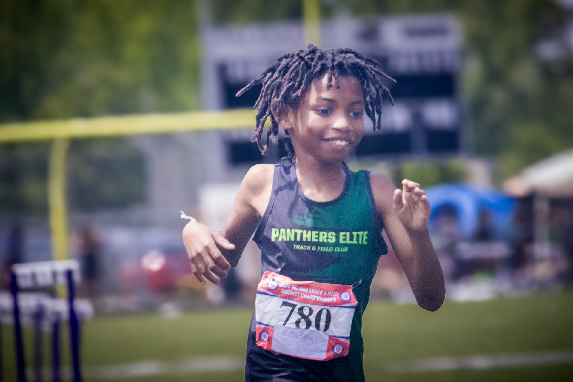Young female runner from Panthers Elite Track & Field Club during race.