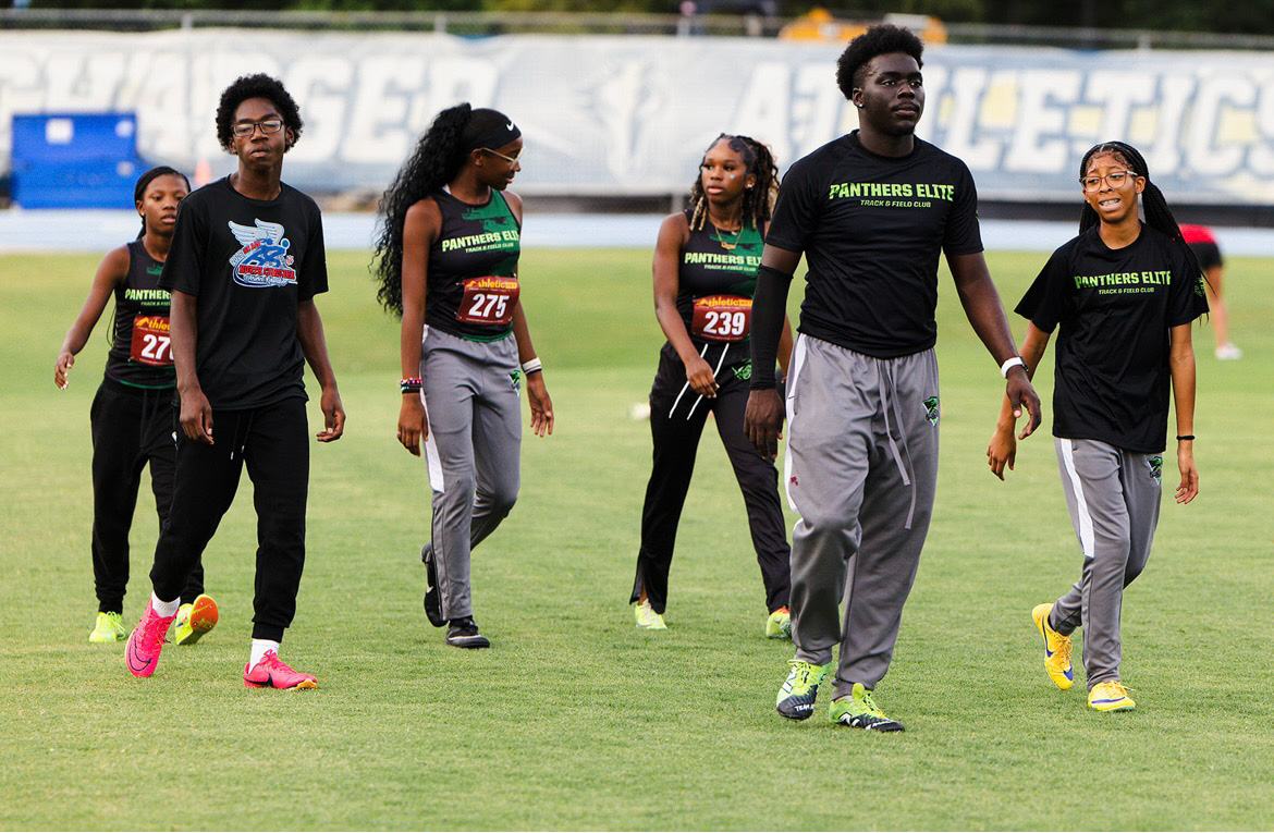 Panthers Elite athletes walking on the track during The Victory Lap 2026 event.